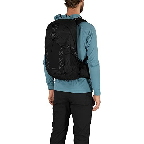 Person wearing a black backpack